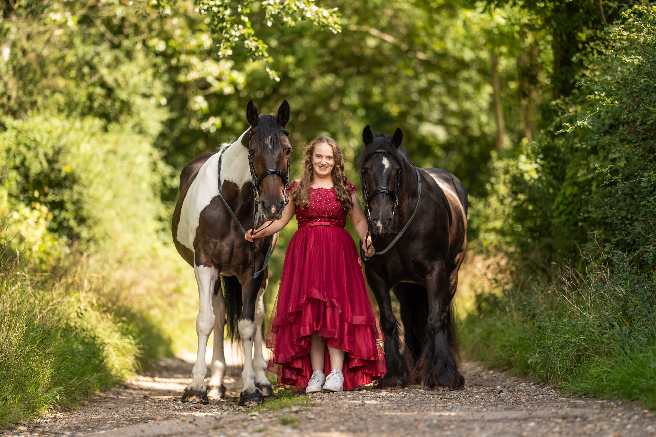 equine photography sussex. human stood with two horses