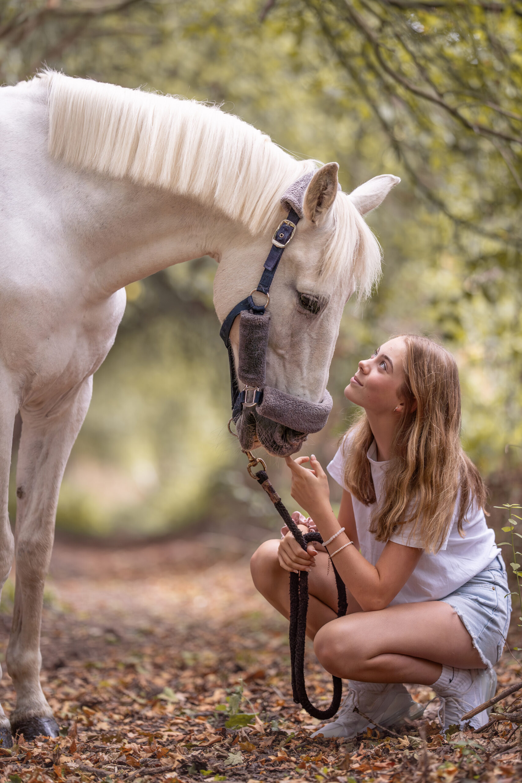 rider crouching looking up at horse. equine photoshoot kent
