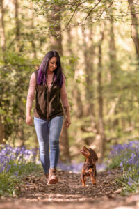 dog and owner walking through woodland - dog photography sussex